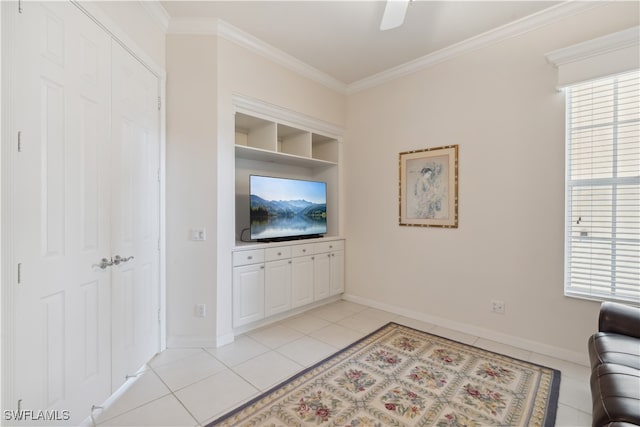 tiled living room with crown molding, ceiling fan, and plenty of natural light