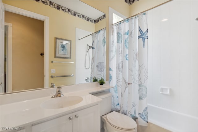 full bathroom with shower / bath combo, vanity, and toilet