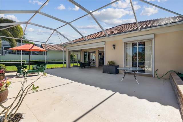 view of patio / terrace featuring glass enclosure