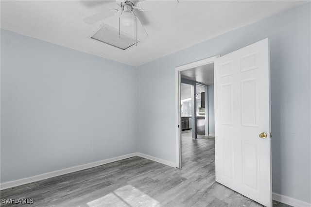 empty room featuring light hardwood / wood-style flooring and ceiling fan