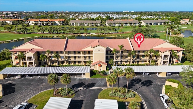 birds eye view of property featuring a water view