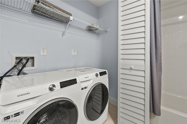 washroom featuring tile patterned flooring and independent washer and dryer