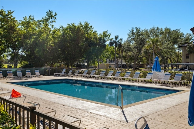 view of swimming pool featuring a patio area