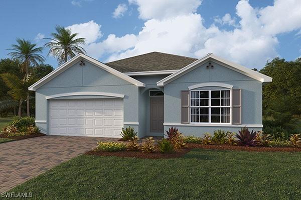 view of front facade with an attached garage, a front lawn, decorative driveway, and stucco siding