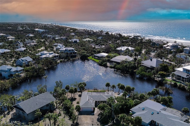 aerial view at dusk with a water view