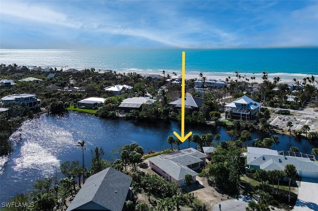 aerial view featuring a view of the beach and a water view