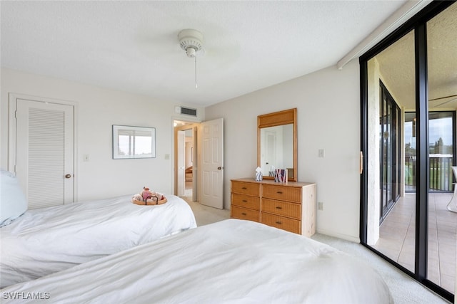 bedroom with light carpet, a closet, access to outside, and ceiling fan