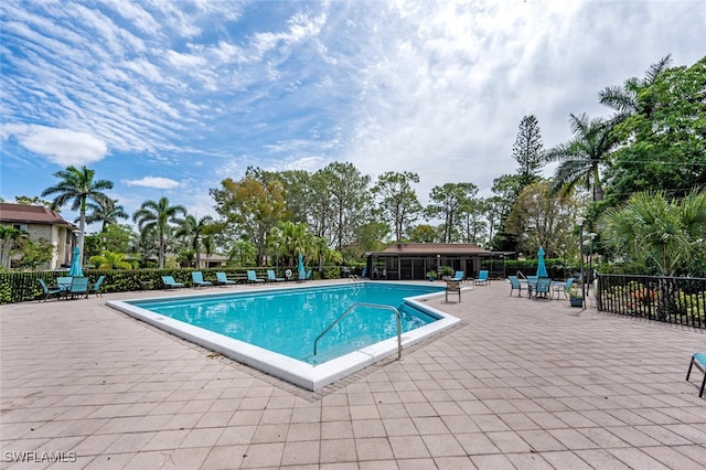 view of swimming pool with a patio area