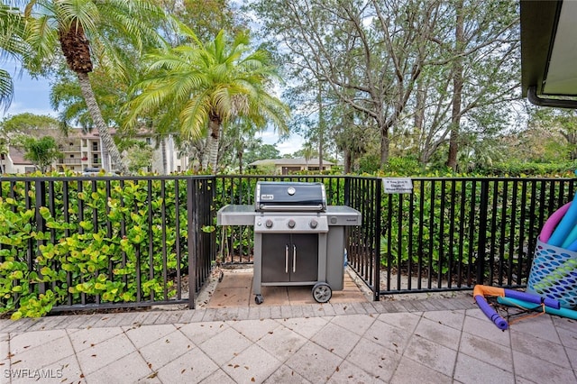 view of patio / terrace with a balcony and grilling area