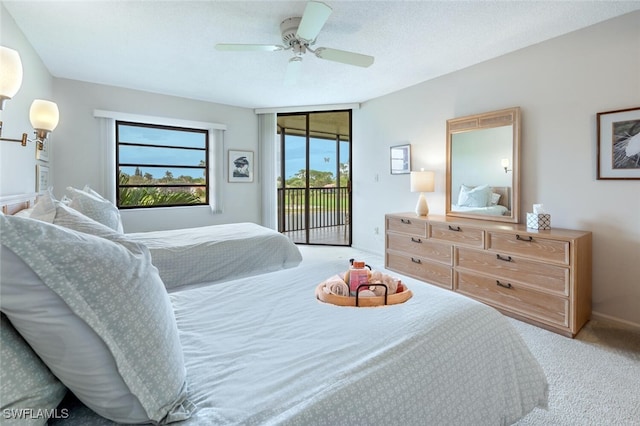 carpeted bedroom with access to exterior and ceiling fan