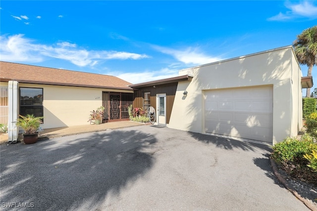 single story home with a garage