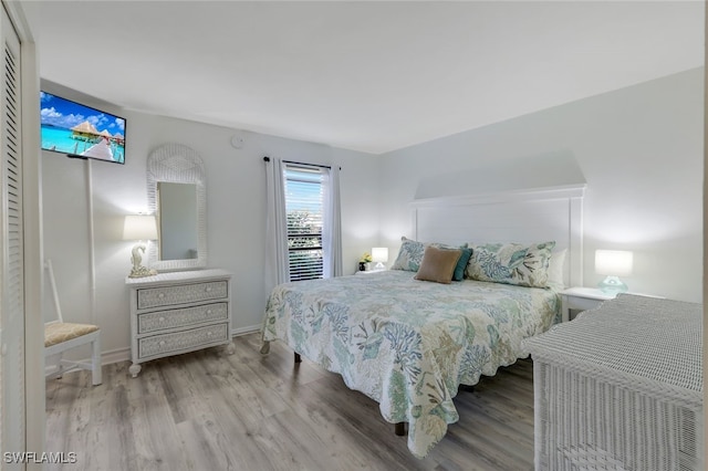 bedroom with light hardwood / wood-style floors