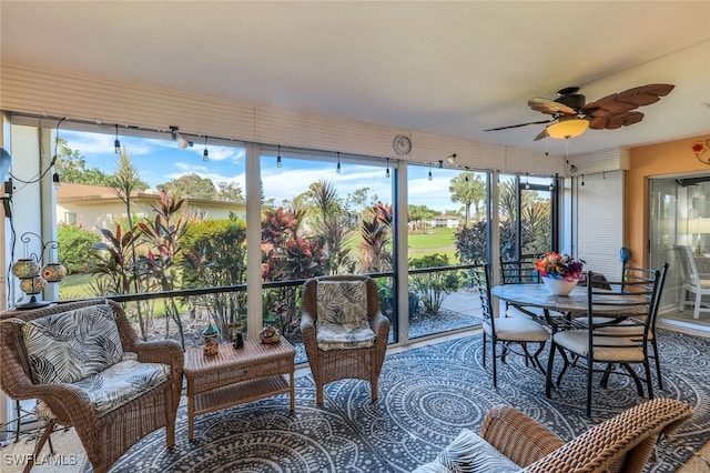 sunroom featuring a wealth of natural light and ceiling fan