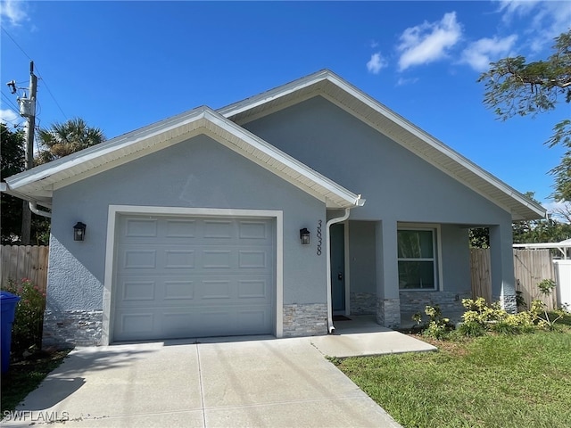 single story home featuring a garage