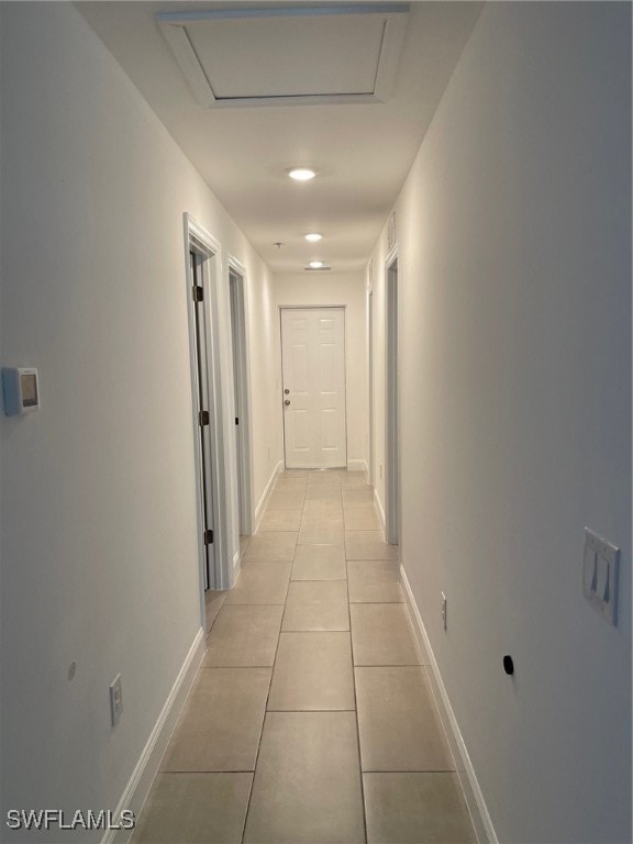 hallway featuring light tile patterned floors