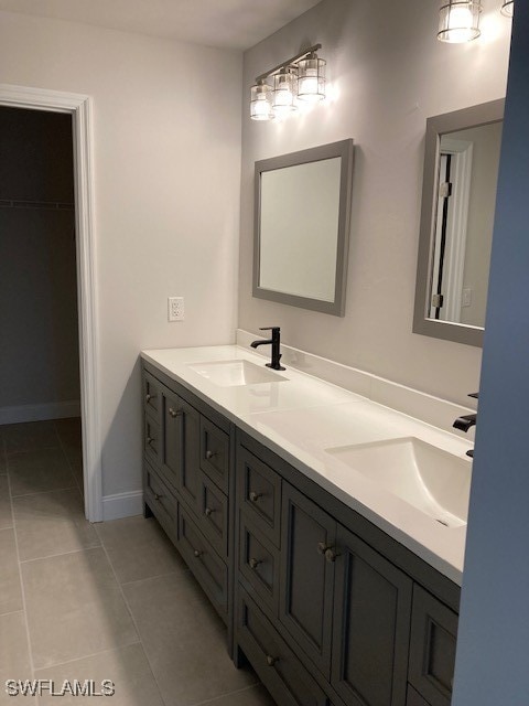 bathroom with tile patterned floors and vanity