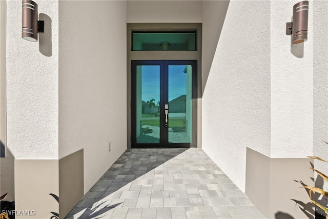 entrance to property featuring french doors