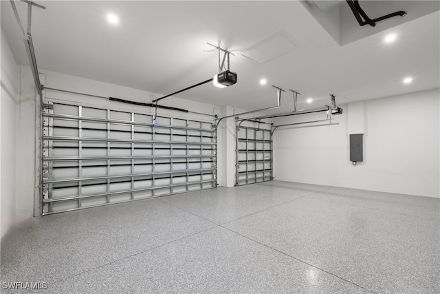 garage featuring electric panel and a garage door opener