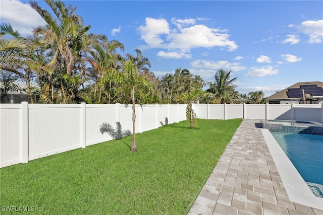 view of yard featuring a fenced in pool