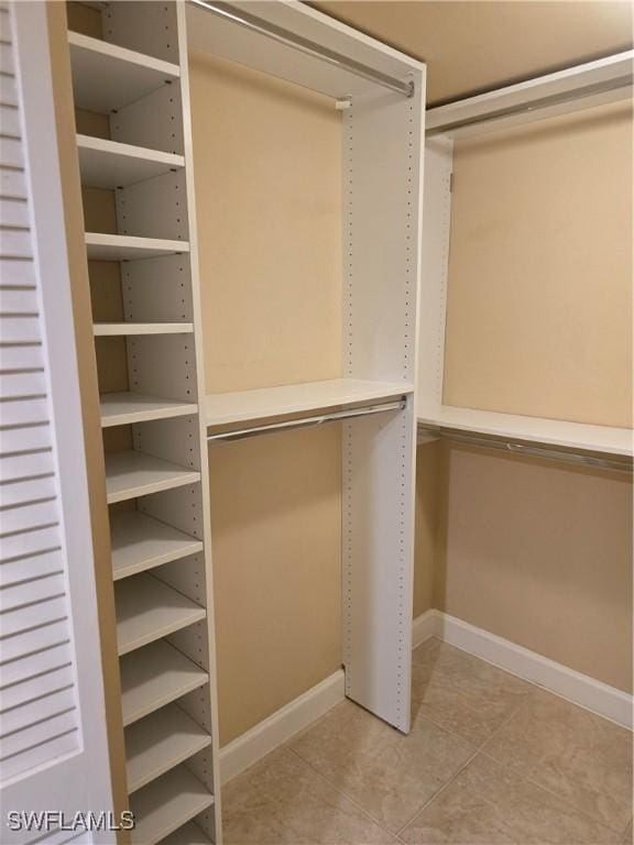 walk in closet featuring light tile patterned floors