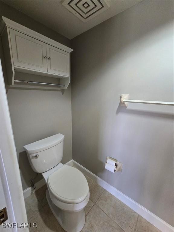 bathroom featuring tile patterned flooring and toilet