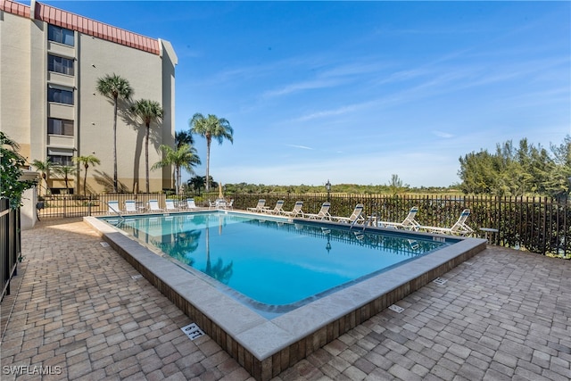 view of swimming pool featuring a patio