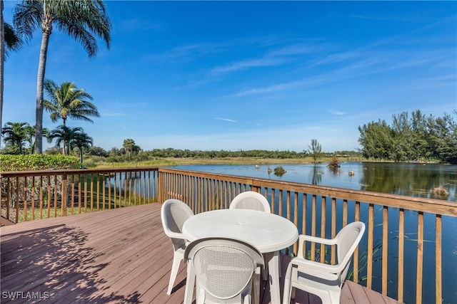 wooden deck featuring a water view