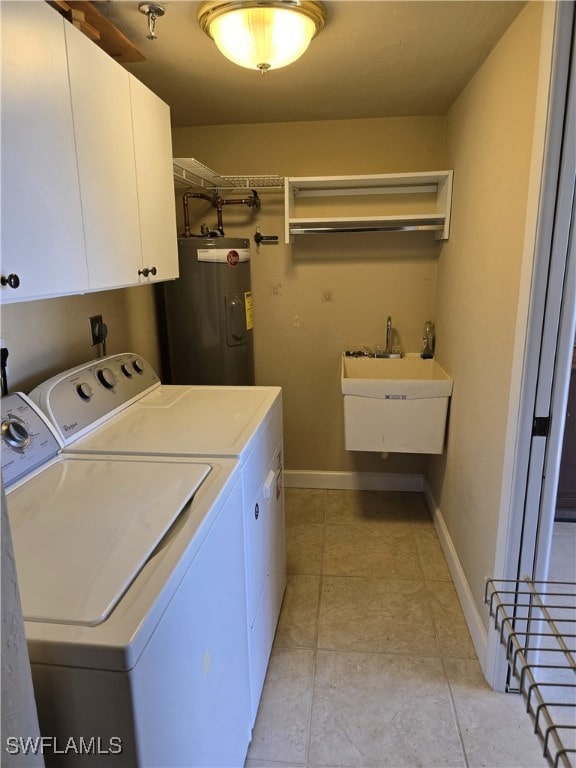 laundry room with sink, cabinets, light tile patterned floors, washing machine and dryer, and electric water heater