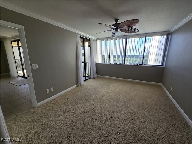 unfurnished room featuring crown molding, ceiling fan, and carpet