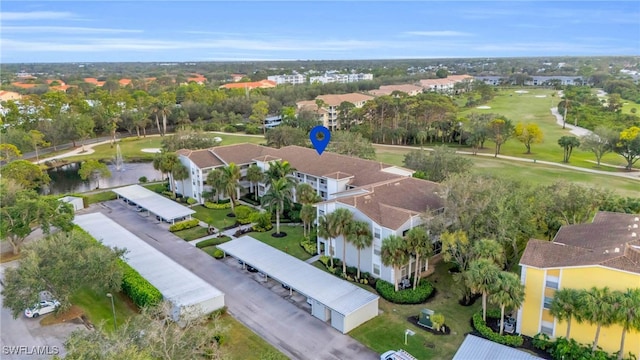 bird's eye view with view of golf course and a residential view