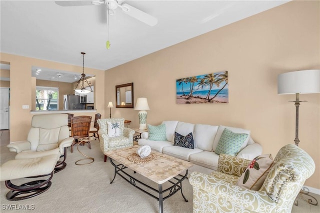 carpeted living room featuring ceiling fan