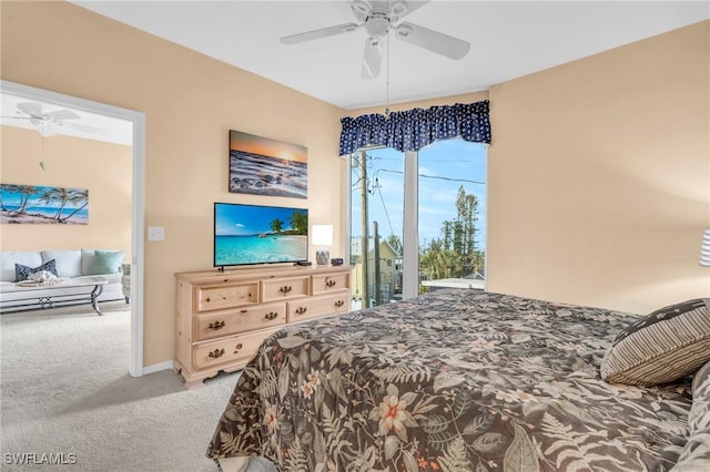 bedroom featuring access to exterior, carpet flooring, and a ceiling fan