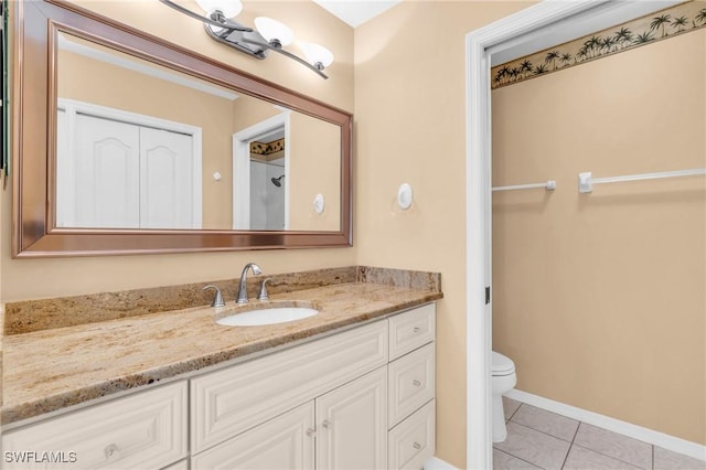 full bathroom with baseboards, vanity, toilet, and tile patterned floors