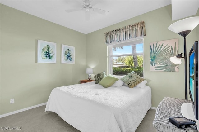 bedroom featuring a ceiling fan, carpet, and baseboards