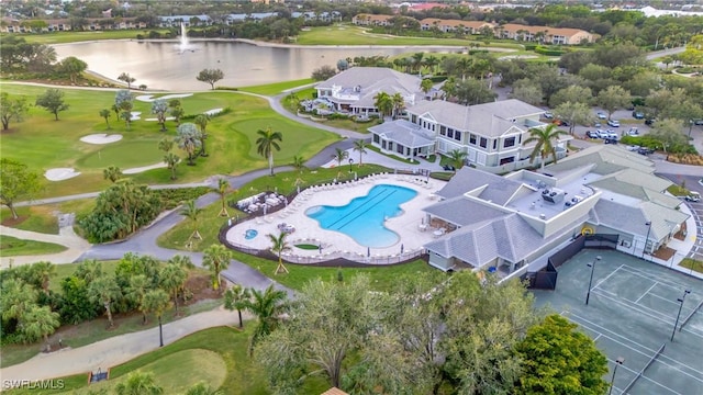 aerial view featuring golf course view and a water view