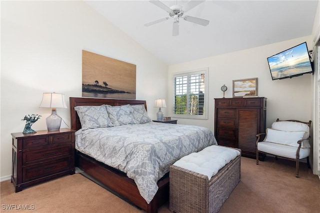 carpeted bedroom with ceiling fan and vaulted ceiling