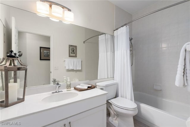 full bathroom with vanity, toilet, and shower / tub combo with curtain