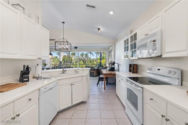 kitchen featuring lofted ceiling, white cabinetry, white appliances, and sink