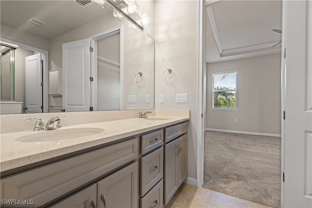 bathroom with vanity and ornamental molding