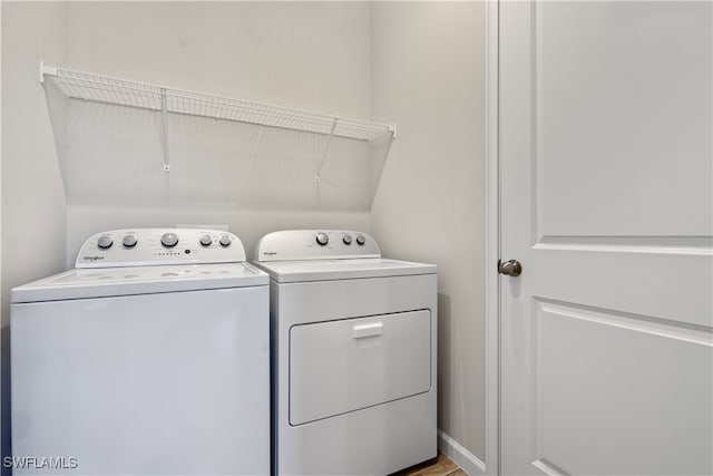 clothes washing area featuring washing machine and dryer