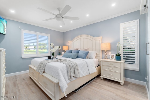 bedroom with ceiling fan, crown molding, and light hardwood / wood-style flooring