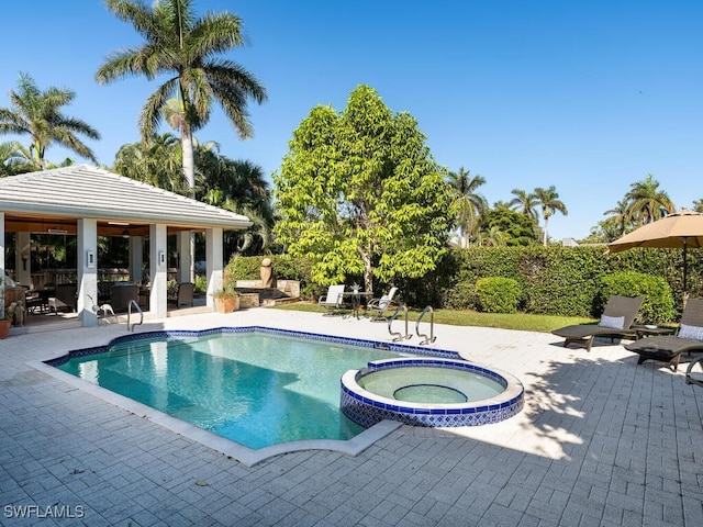 view of swimming pool featuring an in ground hot tub, a gazebo, and a patio area