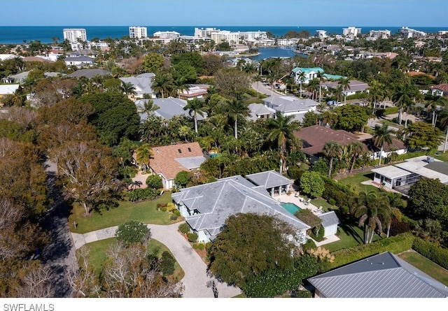 birds eye view of property featuring a water view