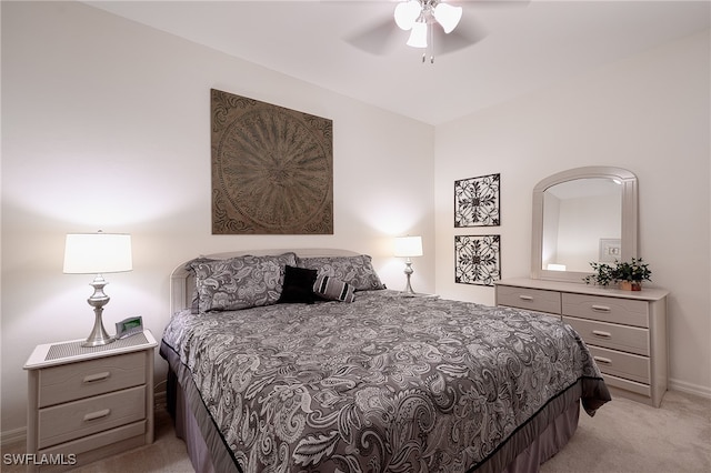 bedroom featuring ceiling fan and light colored carpet