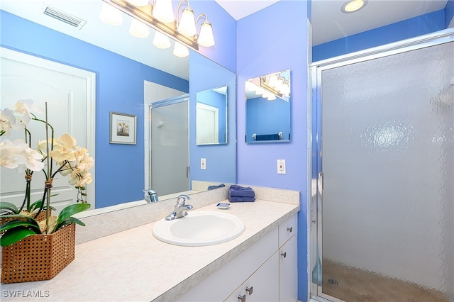 bathroom featuring vanity and walk in shower