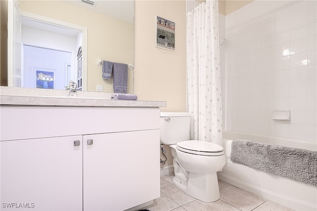 full bathroom with shower / bath combination with curtain, vanity, toilet, and tile patterned floors