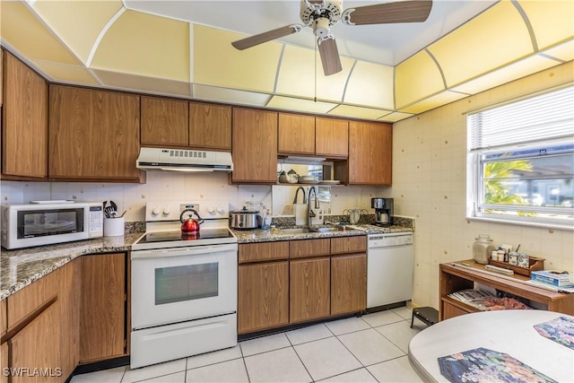 6842 Bogey Dr, Fort Myers, FL 33919 - kitchen featuring exhaust hood, white appliances, a sink, and brown cabinets