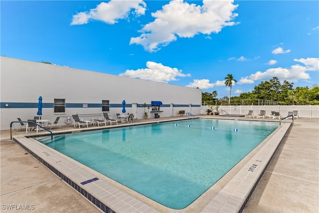 view of swimming pool featuring a patio