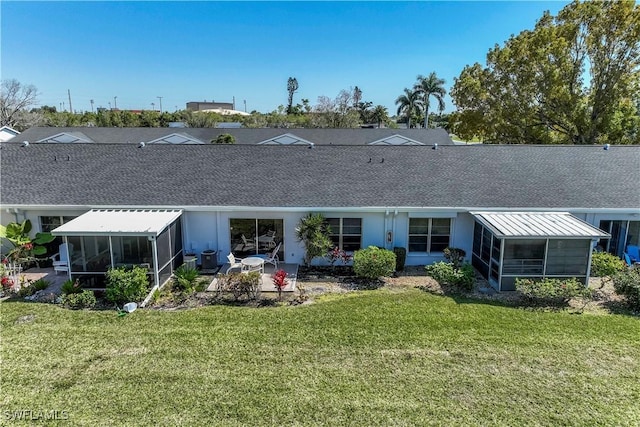 6842 Bogey Dr, Fort Myers, FL 33919 - rear view of house featuring a sunroom, a shingled roof, a lawn, and a patio