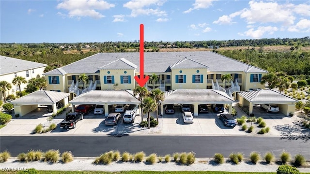 14531 Abaco Lakes Dr Unit 103, Fort Myers, FL 33908 - view of front facade with covered parking